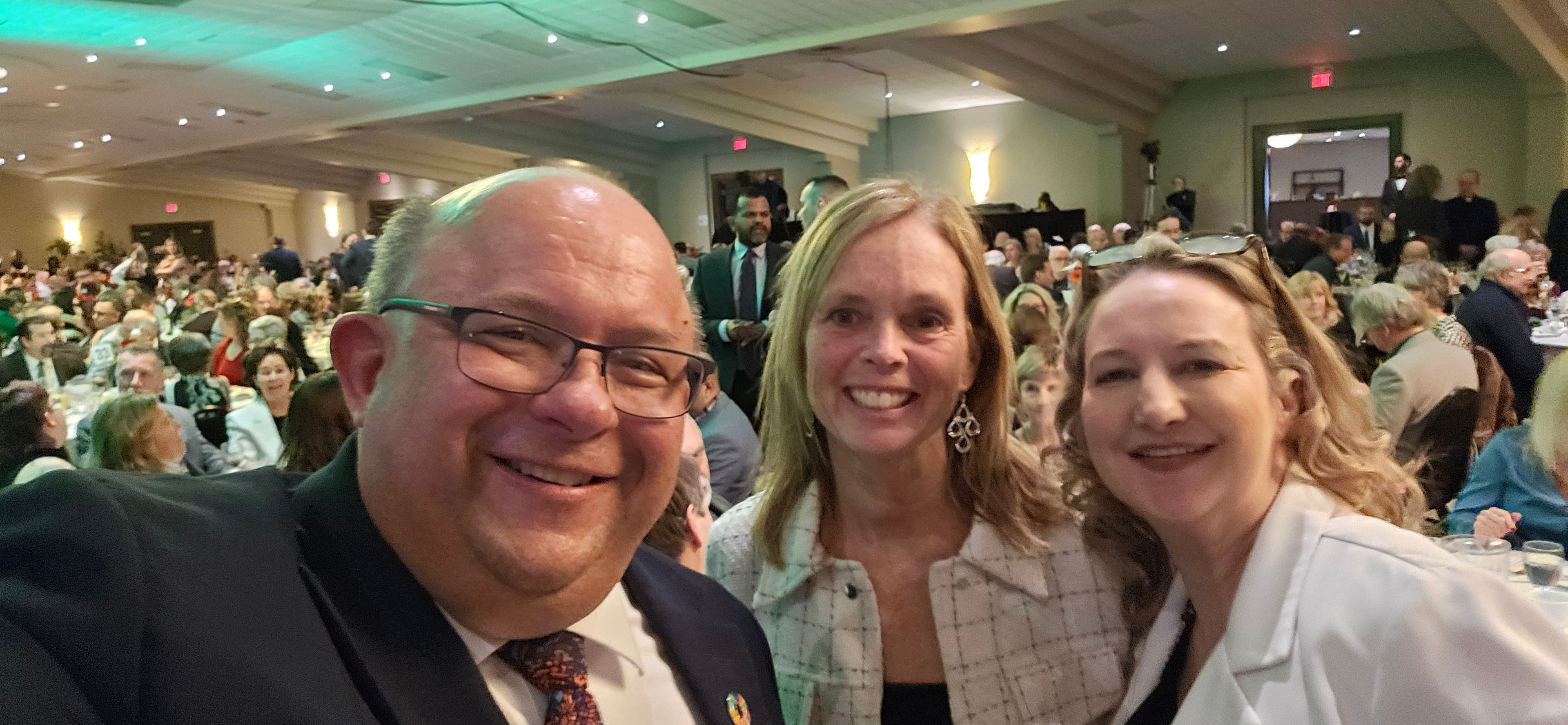 Tracey Weiler at a formal community banquet dinner